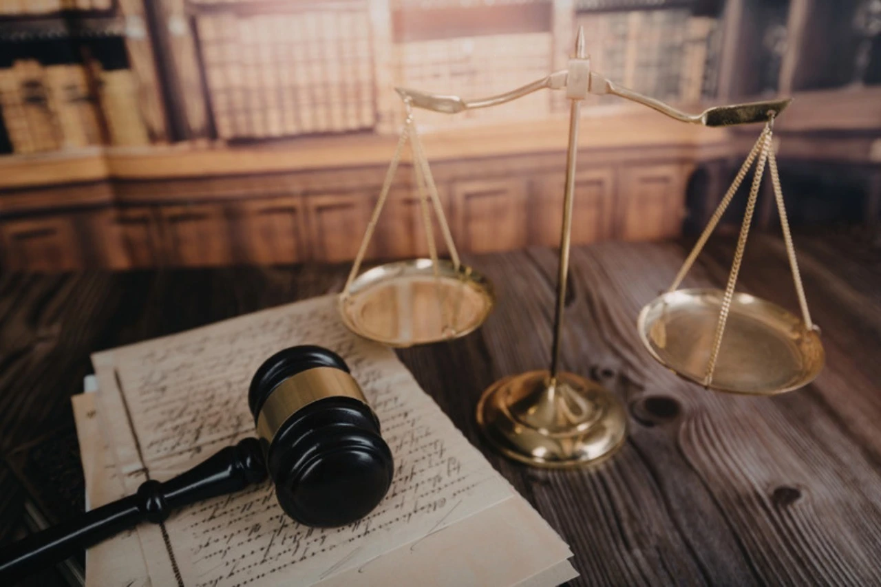 Scales of justice and gavel in law library