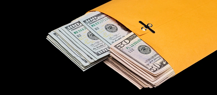 Cash in envelope representing federal fraud charges